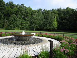 The Contemporary Rounded fire bowl in Granite Green Water Features ConcreteCreationsLA 